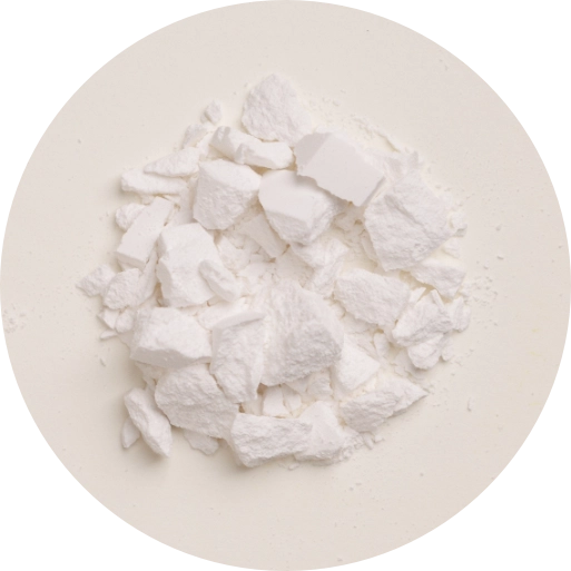 A pile of white, irregularly shaped calcium powder or chunks on a light beige circular background.